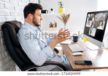 Zoom conference. Business partners communicate via video using laptop. The guy talks with his business partners appearance about plans and strategy. Distant work Royalty-Free Stock Photo #1716024499