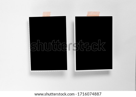 Blankphoto frame with soft shadows and scotch tape isolated on white paper background as template for graphic designers presentations, portfolios etc.