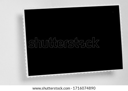 Blank  photo frame with soft shadows and scotch tape isolated on white paper background as template for graphic designers presentations, portfolios etc.