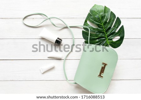Fashion green bag woman accessories white background. Trendy fashion luxury handbag design. Lifestyle and Beauty Concept