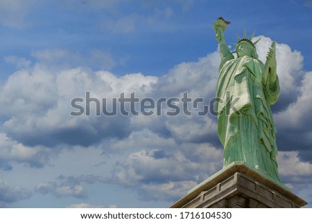 The Statue of Liberty on New York blue perfect sky of clouds