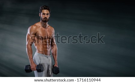 Handsome Muscular Men, Bodybuilder Training With Dumbbells. Copy Space Royalty-Free Stock Photo #1716110944