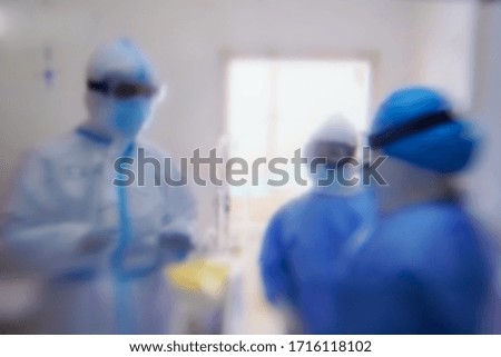 Blur the medical team wore PPE and examined patients with coronavirus covid 19.