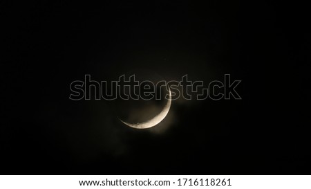 
clouds passing in front of the moon in ramadan