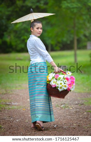 Beautiful asian young woman of north thailand traditional dress, identity culture of Thailand.