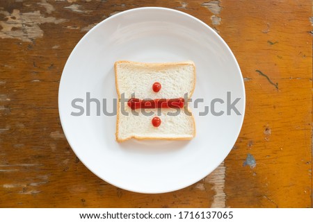 bread of breakfast is written Divide sign by ketchup on write plate. A to Z and Number and Special characters set.