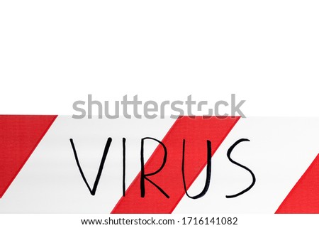 Red and white warning tape with the inscription virus close up on white background. Concept for protecting people from coronavirus infection. Covid-19