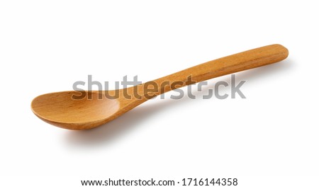 Wooden spoon placed on a white background Royalty-Free Stock Photo #1716144358