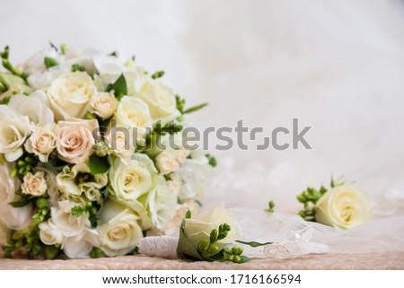 Bridal wedding bouquet in white and beige colours. Tenderness flowers