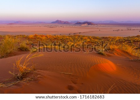 View of Sesriem at sunset from the top of the Elim dune in Namibia in Africa. 