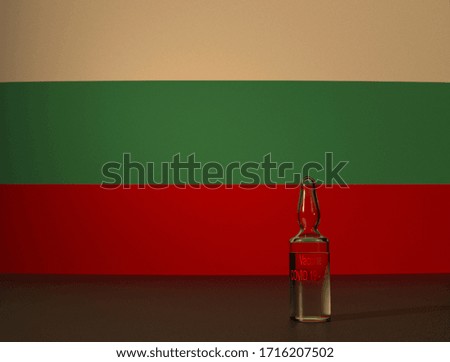 COVID 19 virus vaccine against the backdrop of the Bulgaria flag. Close-up.