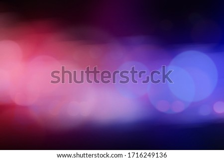 Blurred view of police cars on street at night Royalty-Free Stock Photo #1716249136