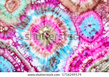 part of abstract bright ornament in tie-dye batik technique handpainted on silk head scarf Royalty-Free Stock Photo #1716249574