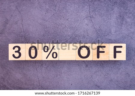 30 percent off text made with wood building blocks.