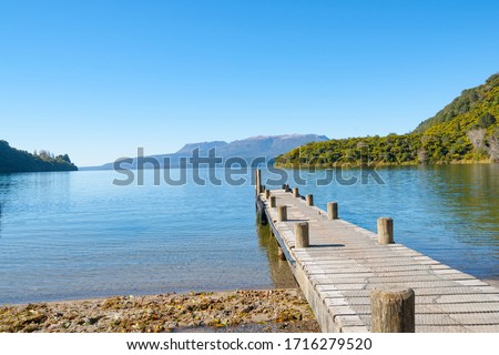Jetty projecting into scenically beautiful Lake Tarwera in New Zealand.