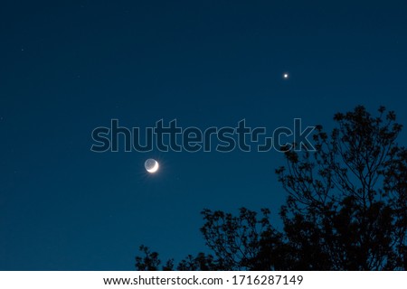 Conjunction of planet Venus and crescent moon