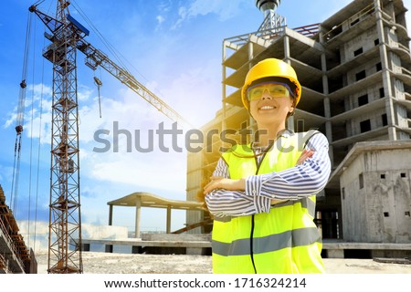 Professional engineer in safety equipment at construction site Royalty-Free Stock Photo #1716324214