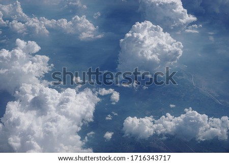 Beautiful View Of White Cloudy Sky From Above. Sky Landscape View Shot From Airplane Window.  Traveling With Airline. Side View From Inside. Cummulus Cloud
