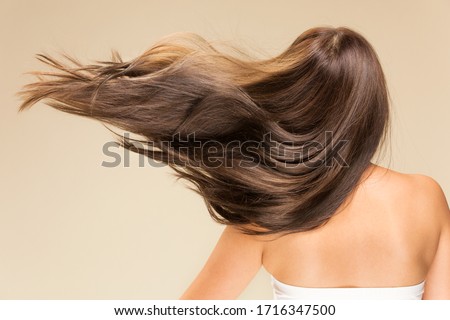 Lively hair on a beige background.