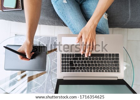 Graphic designer woman smart working on computer at home - Young female drawing with interactive pen and laptop - Wireless technology and design freelance job lifestyle concept