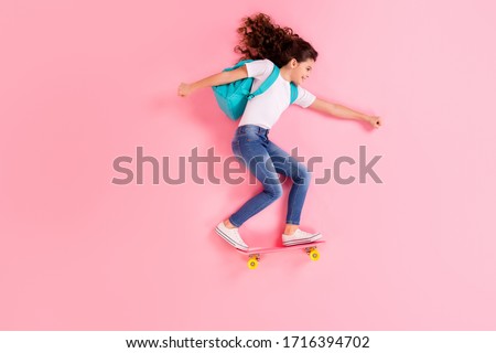 Top view above high angle flat lay flatlay lie concept full length body size view of nice cheerful cheery girl jumping standing on board riding having fun isolated on pink pastel color background Royalty-Free Stock Photo #1716394702