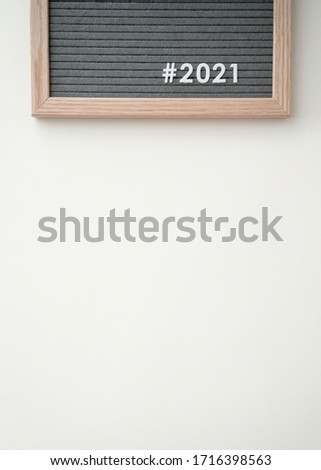 Happy new year 2021 concept banner. Flat lay felt board typography poster. #2021 hashtag global recovering idea. Flat lay, top view.