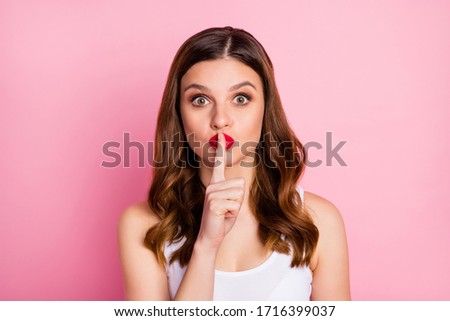 Hush dont tell anyone. Astonished ginger hair girl know incredible gossip impressed put mute sign index finger mouth ask keep secret wear good look tank-top isolated pink color background Royalty-Free Stock Photo #1716399037