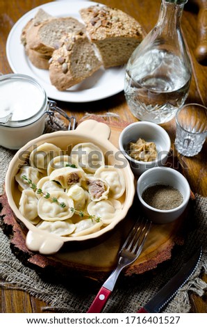 Boiled dumplings. Traditional meat dish of Russian cuisine