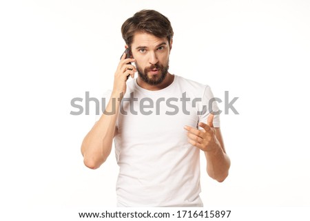 Man white t-shirt emotion mobile phone