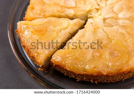Homemade apple pie on a stone countertop. Appetizing breakfast, author's recipe.