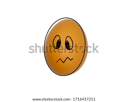 
Brown chicken egg with different faces