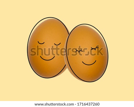 
Brown chicken egg with different faces