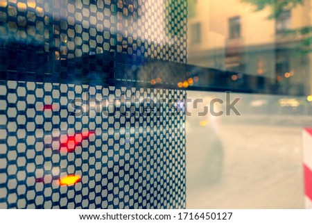 Reflection of street life in window glass