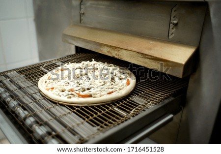 
in the cafe they cook pizza and bake it in the oven
