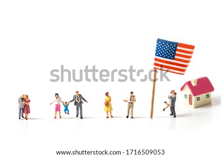 selective focus of miniature people , couple , and family  with United State flag isolated on white background, creative image for 4 July independent day celebrate concept.