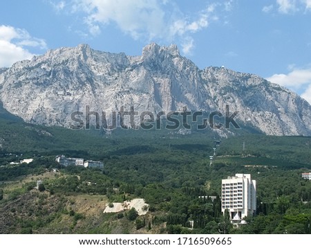 View of Crimean coastline and cliffs of Ay-Petry in the Crimea mountains, Ukraine. This is the highest mountain of the Crimea near Yalta. Black sea. Soft focus Royalty-Free Stock Photo #1716509665