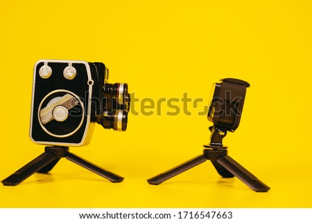Video camera. Retro camera and modern digital video camera.