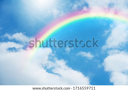 Blue sky and clouds with rainbow. Royalty-Free Stock Photo #1716559711