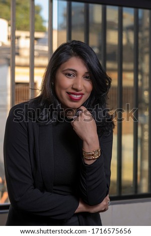 smiling business woman and arms crossed in corporate photo graffiti 
