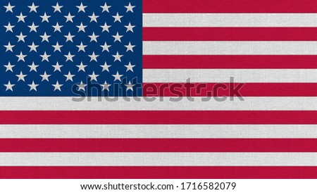Realistic flag of America on the surface of fabric.