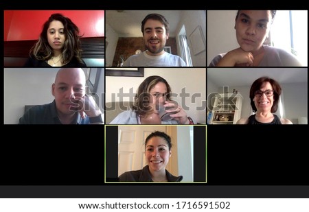 Shot of a screen of teammates doing a virtual conference from their home offices.  Team meeting from home during COVID-19 coronavirus pandemic. Royalty-Free Stock Photo #1716591502