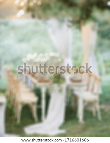 Blurry view of Wedding table set for dining.suitable for wedding background.