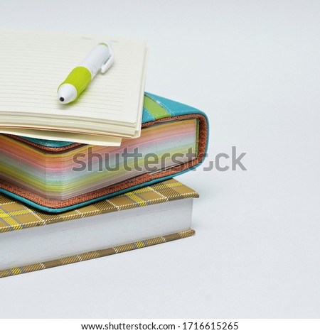 Home office desk. Notebook with a pen and  on a white background. 