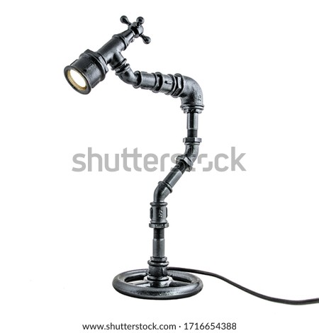 Designer lamp made of metal tubes original idea table lamp in loft style isolated on white background