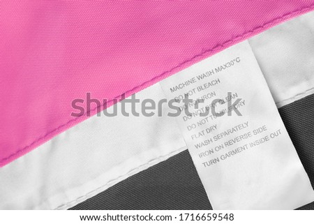 Care clothes label on textile colorful background