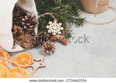 Zero waste and eco friendly christmas concept. Natural decorations and branches of a Christmas tree on the table