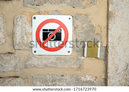 No photography, camera prohibited symbol.
