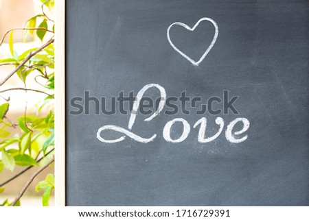 Blackboard with the word love and a drawn heart