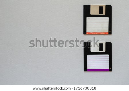 3.5 inch magnetic floppy disks. Two magnetic diskettes with a capacity of 1.44 MB. Obsolete digital data storage media. Close-up. Selective focus.
