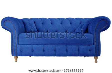 Navy blue sofa with pillows on wooden legs isolated on white. Darck blue suede couch isolated Royalty-Free Stock Photo #1716833197